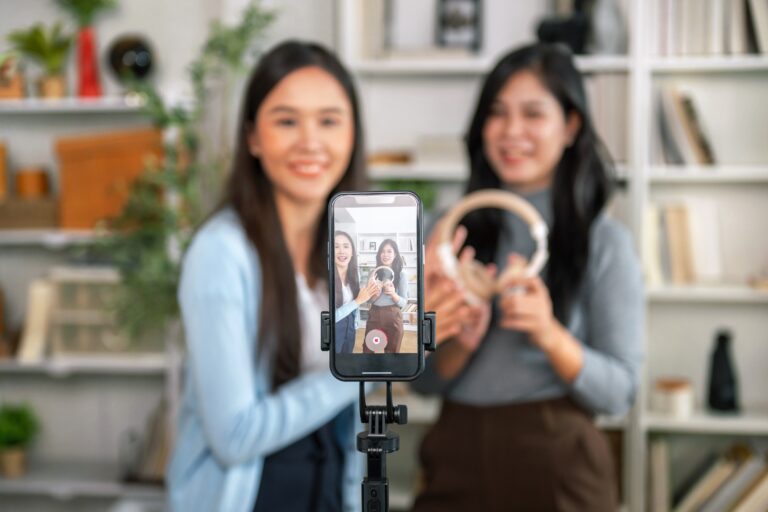 Two,Female,Salespeople,Are,Live-streaming,A,Sale,On,Their,Mobile